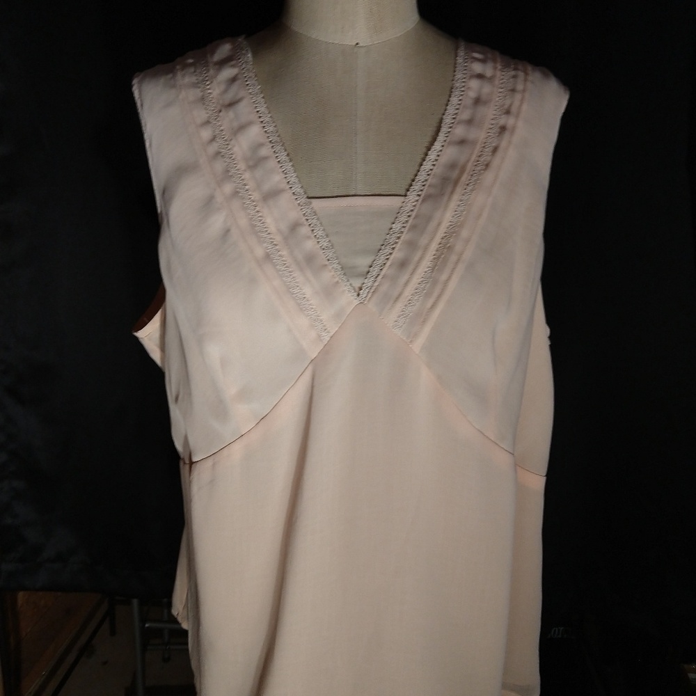 Light pink sleeveless blouse